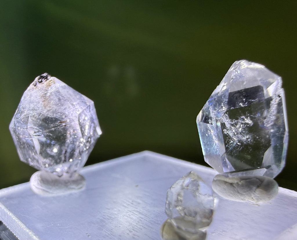 A collection of 5 Petite Herkimer Diamonds (Quartz) from Fonda, NY in  Suspension Frame