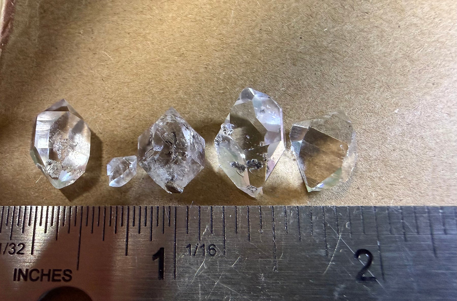 A collection of 5 Petite Herkimer Diamonds (Quartz) from Fonda, NY in  Suspension Frame